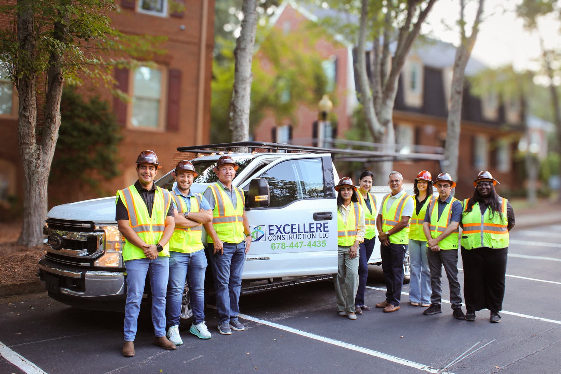 Excellere's crew together beside their company truck at a Georgia jobsite